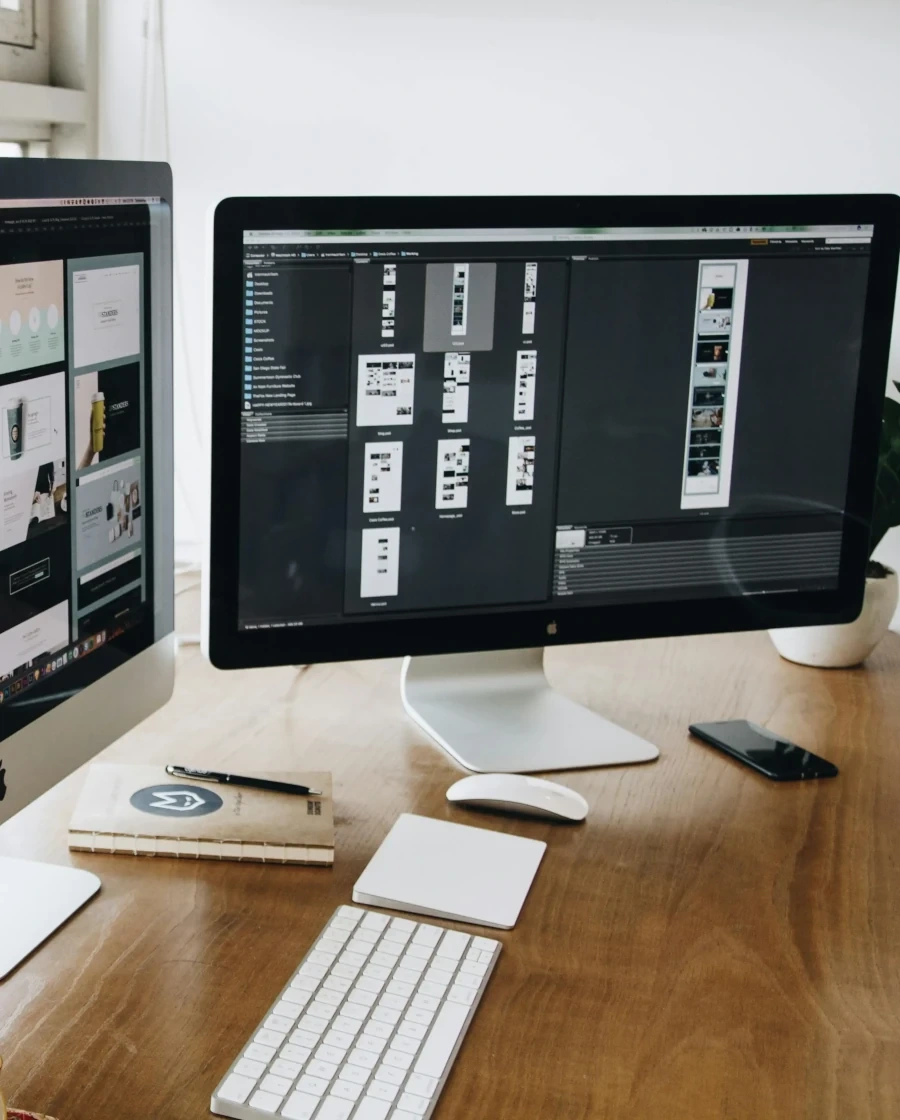 web development environment with monitors and keyboard